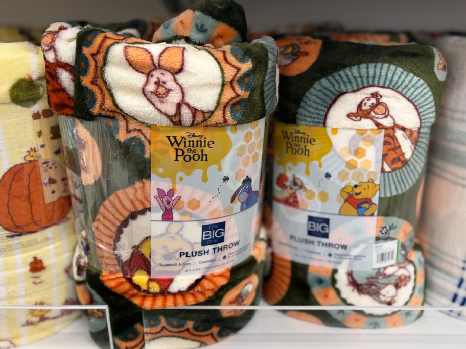 winnie the pooh gray blankets on shelf
