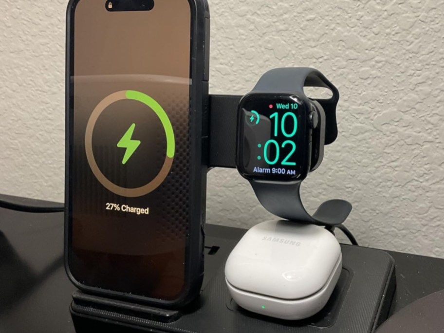 iphone, apple watch and earbuds charging on wireless charging station