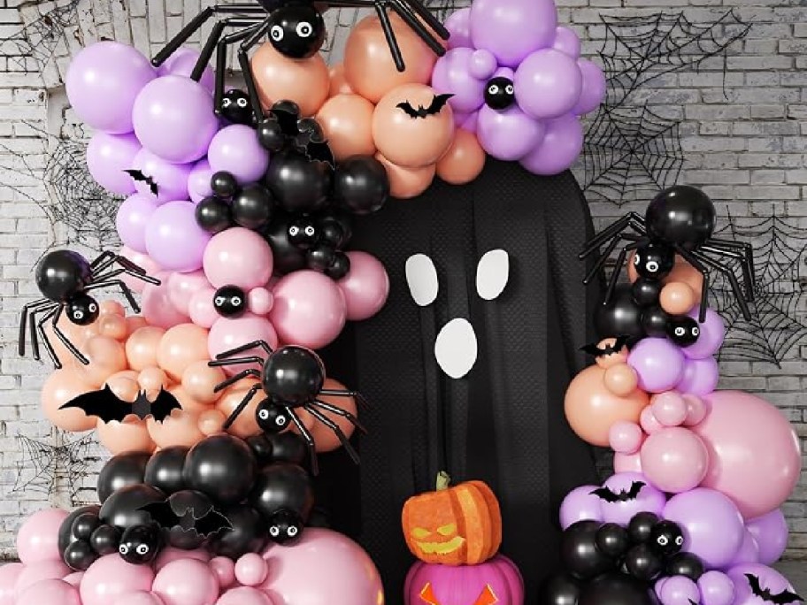 pink, purple, orange, and black Halloween balloon arch