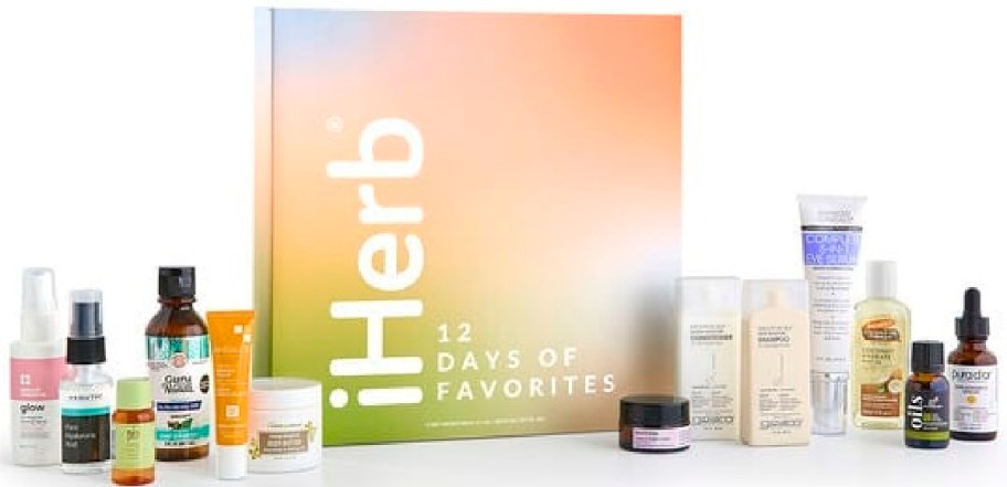 An iHerb 12 Days of Favorites 13-piece beauty and skincare product set with a gradient box and various bottles, tubes, and jars displayed in front.