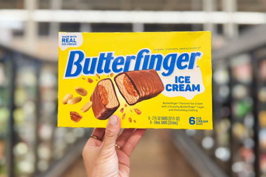 hand holding yellow box ice cream candy bars in store