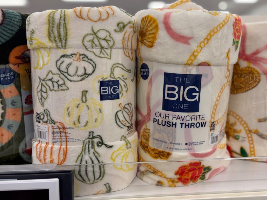 white blankets with pumpkins on shelf 