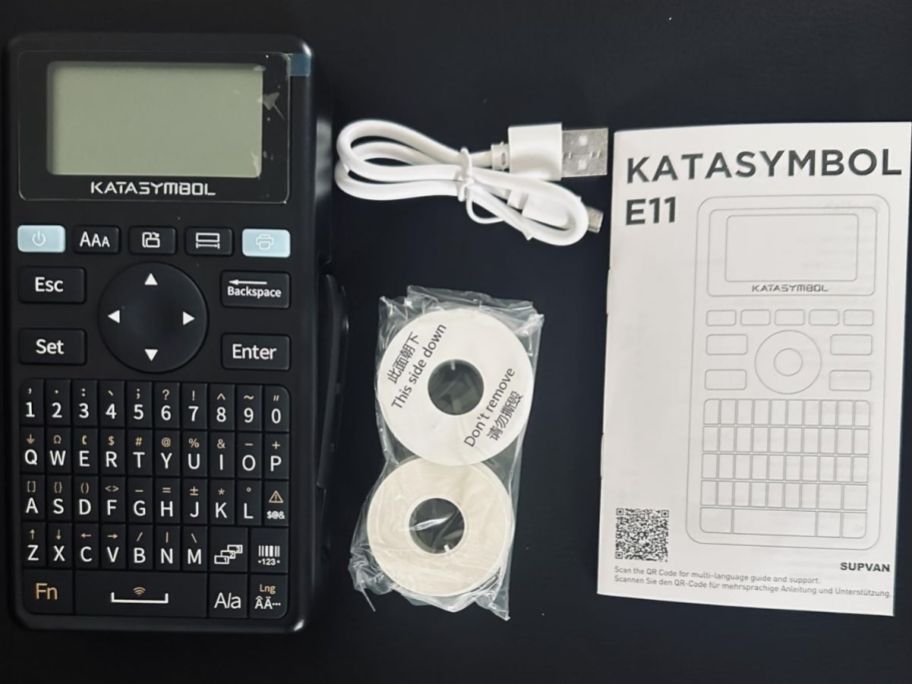 label maker with all the items it comes with on top of the table