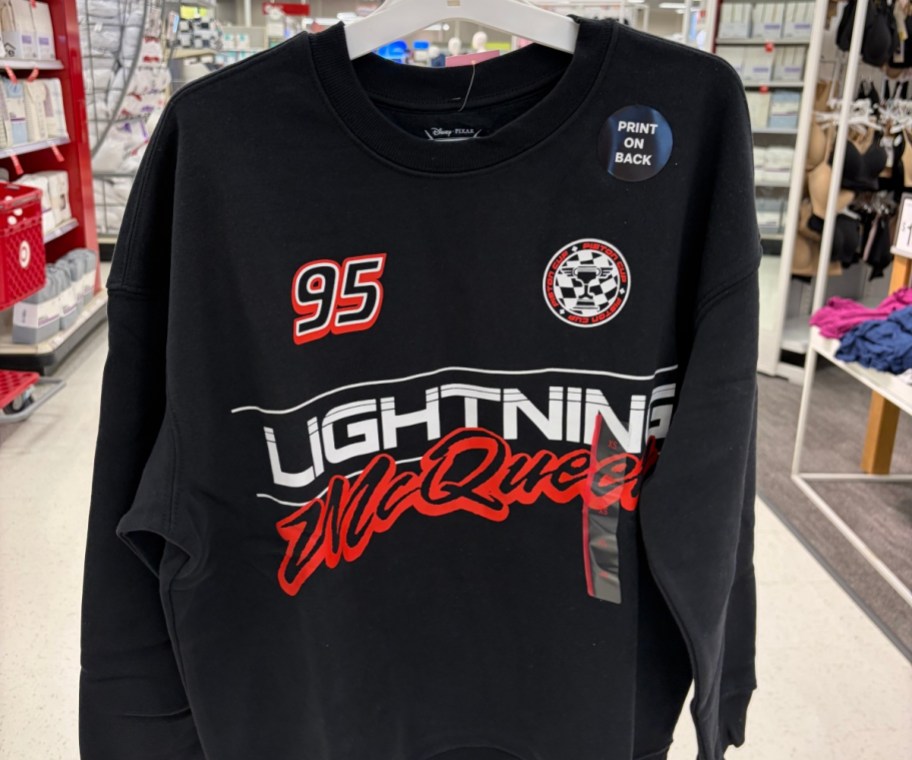 black Lightning McQueen sweatshirt on a white hanger