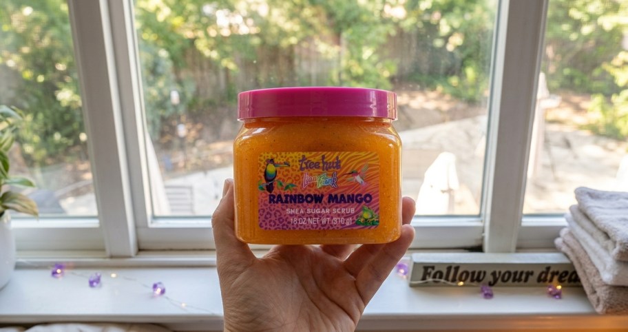 hand holding body scrub