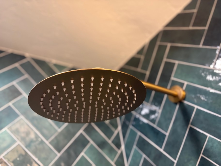 closer up of bottom of gold shower head