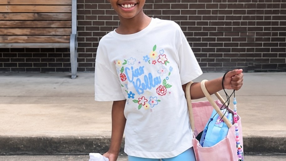 little girl in a graphic tee