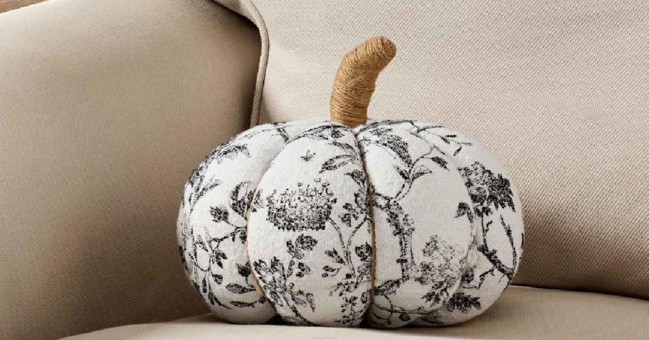 black and white pumpkin pillow on couch