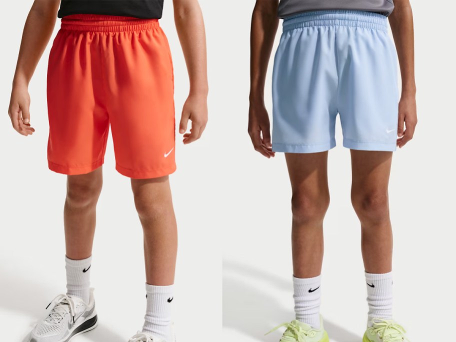 boys wearing orange and blue shorts