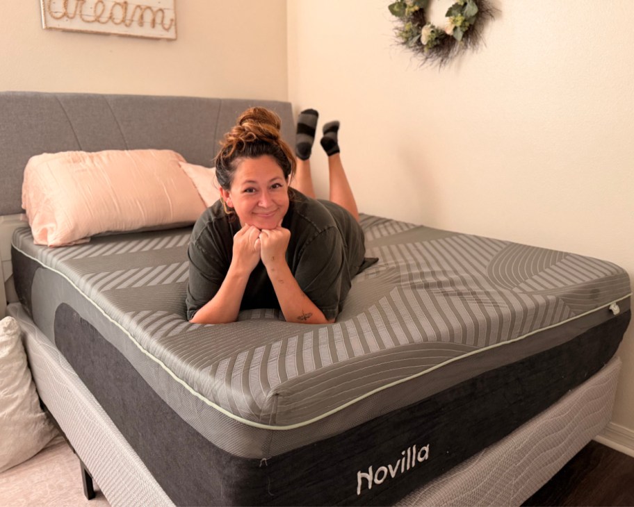woman laying on grey mattress no sheets