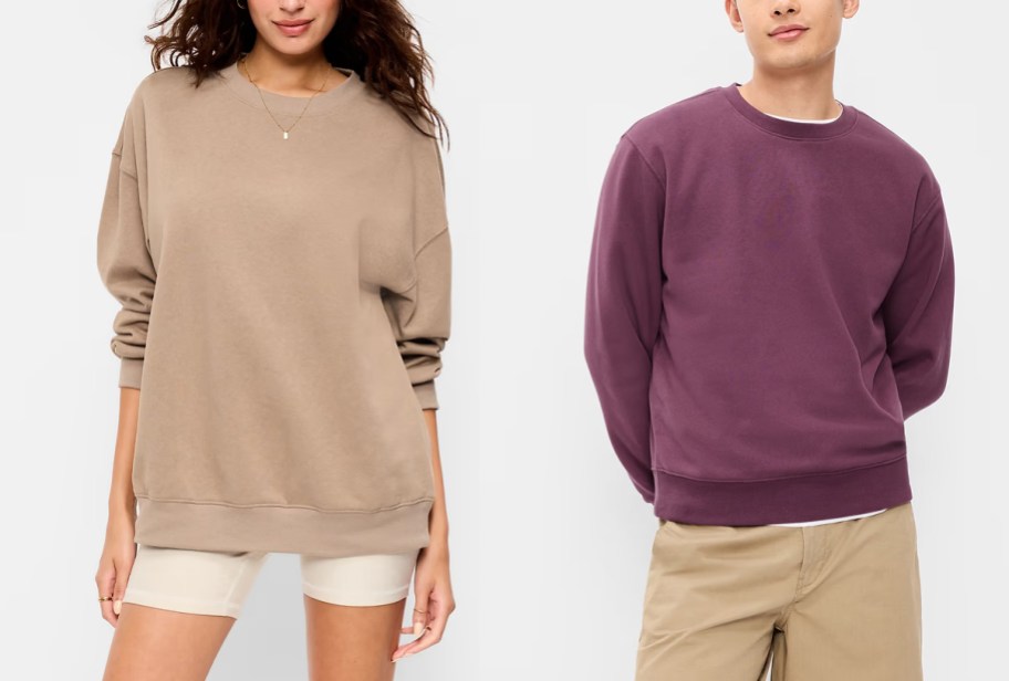 woman in tan sweatshirt and man in purple sweatshirt