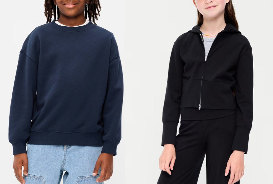 boy wearing blue sweatshirt and girl wearing black hoodie