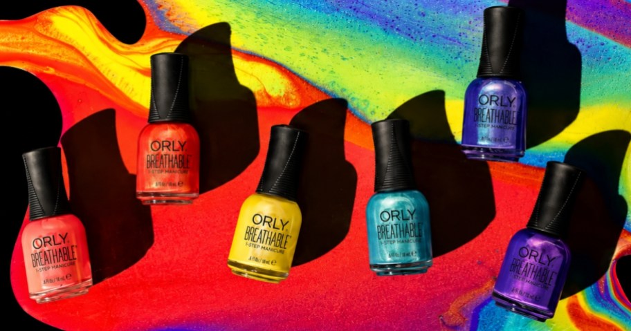 six bottles of ORLY Nail Lacquer in different colors with the polish behind it