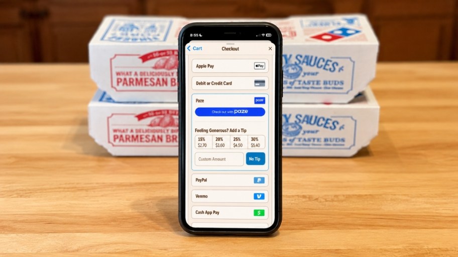 paze app on an iphone shown with dominos boxes