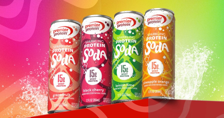 Four cans of Premier Protein Sparkling Soda in grapefruit, black cherry, lemon lime, and pineapple orange flavors against a colorful splash background.