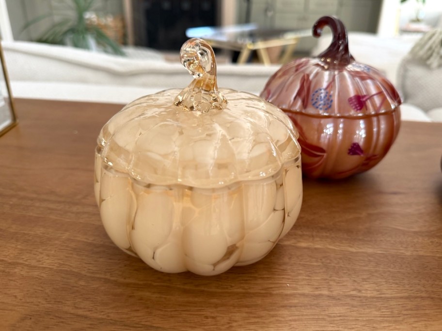pumpkin candles on counter 