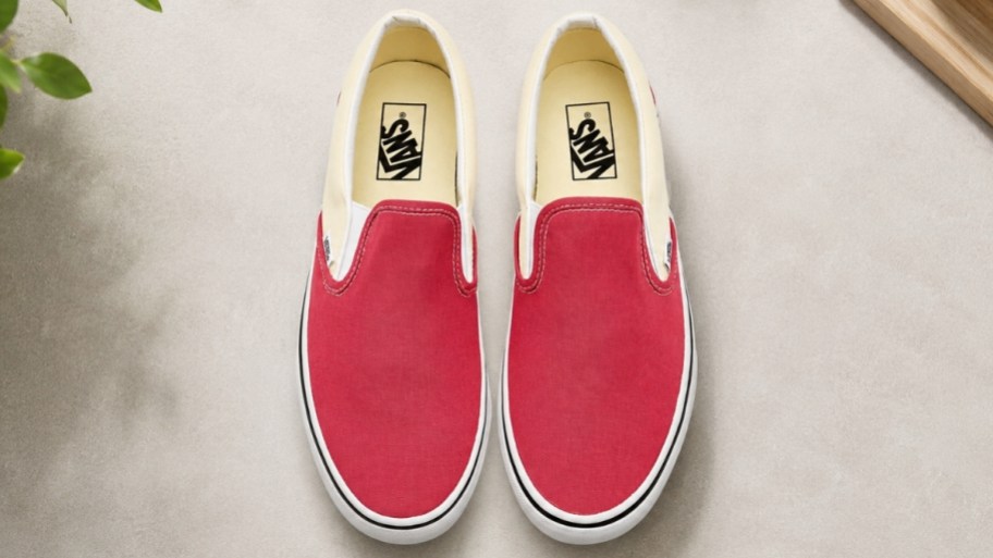 a pair of red slipon vans sneakers