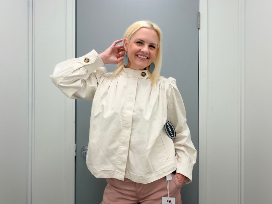 woman wearing white jacket in Walmart dressing room