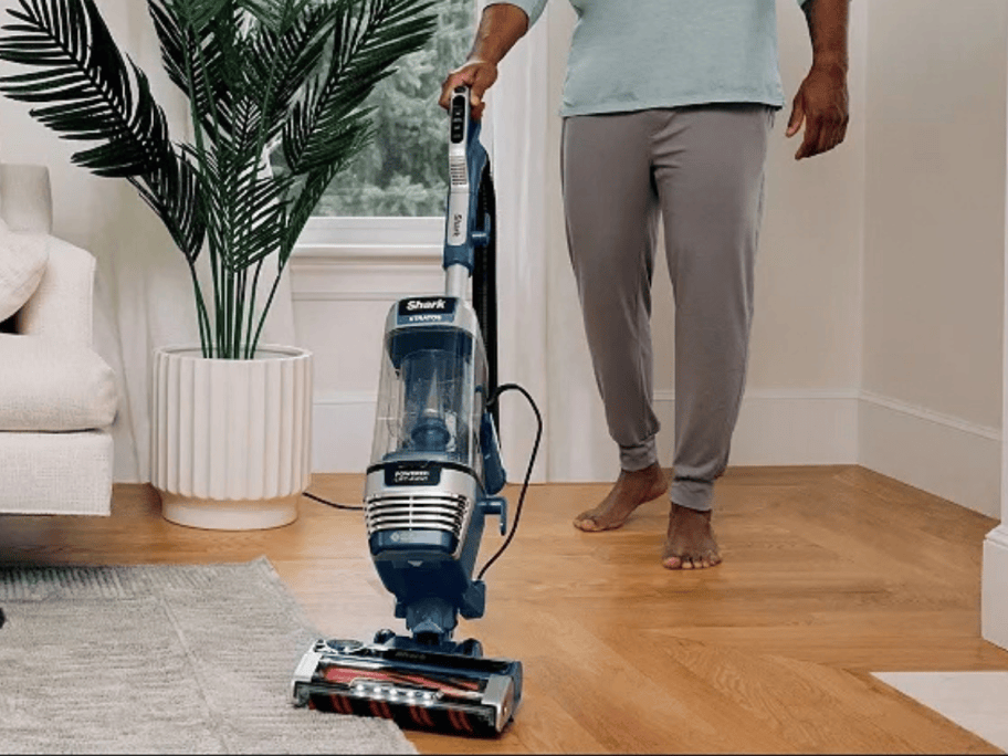 man vacuuming