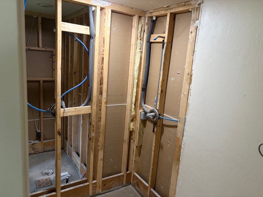 demo bathroom shower with studded walls