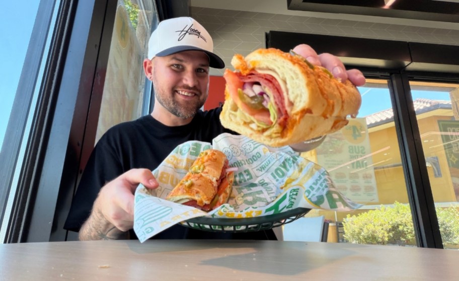 a man with a hot honey sub sandwich