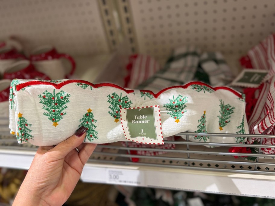 hand holding christmas table runner