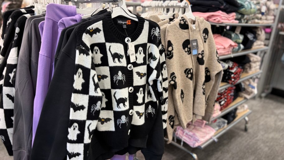 a black and white checkerboard black cat cardigan and beige skull print hoodie sweaters