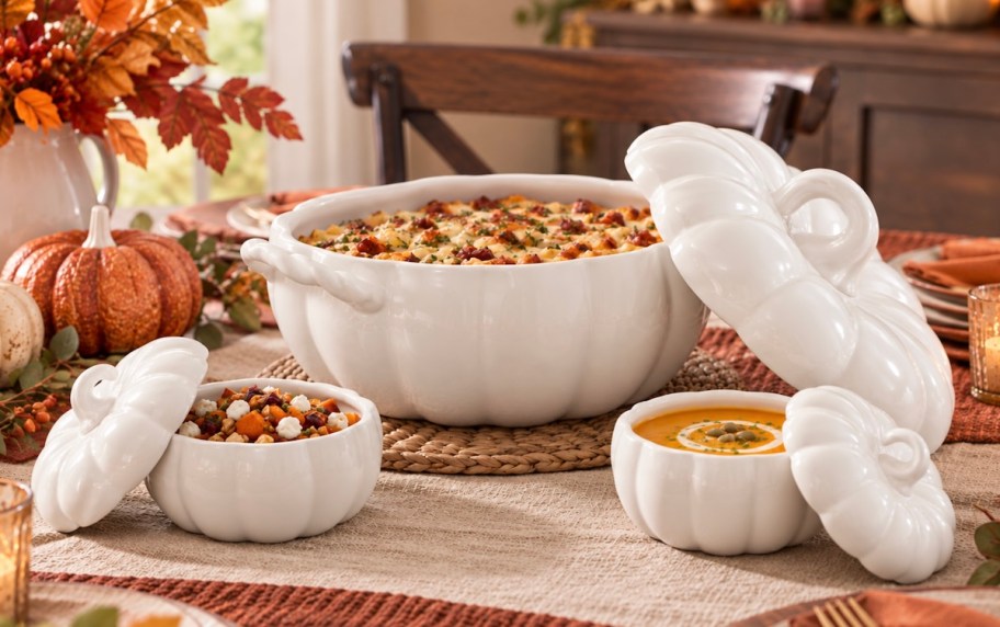 pumpkin bakeware dishes with food on fall tablescape