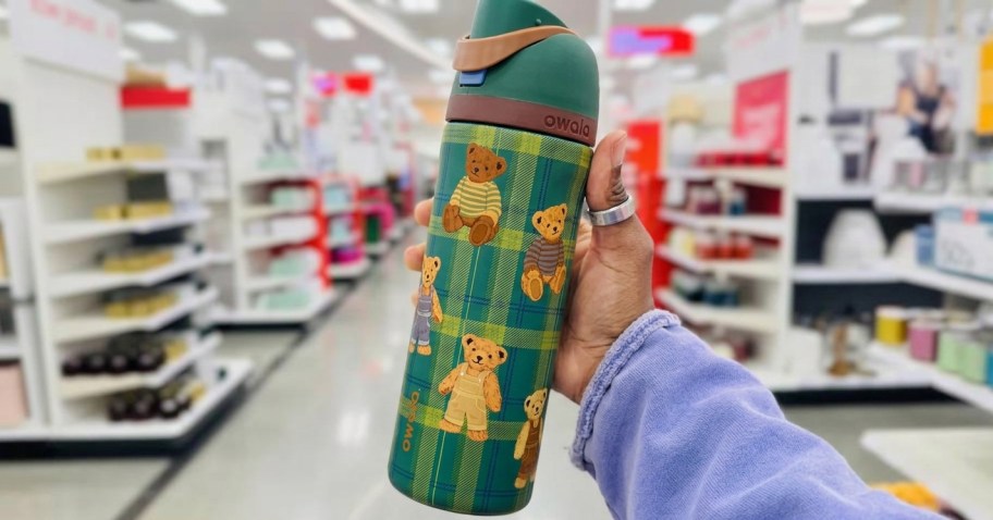 hand holding a water bottle in-store