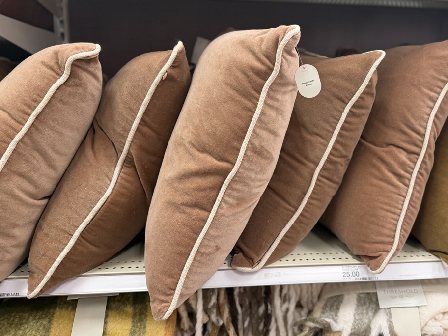 square brown pillows on shelf 