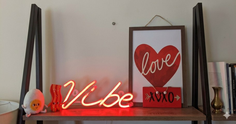 neon sign sitting on a desk