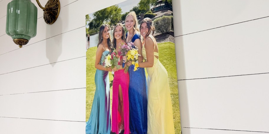 teen with friends in dresses on canvas hanging on wall 