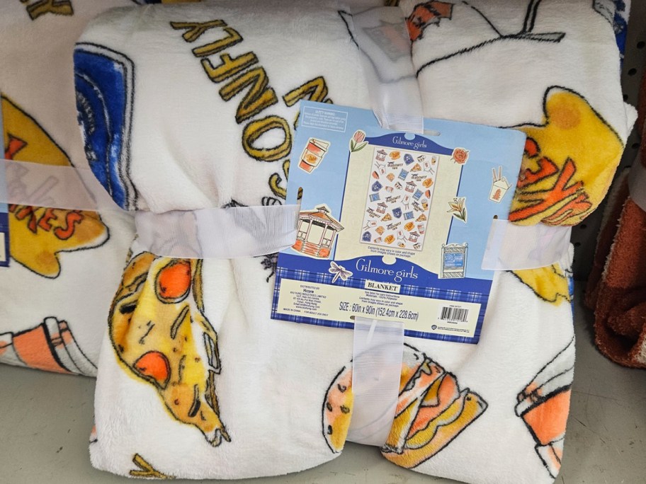 white blanket with pizza on it 
