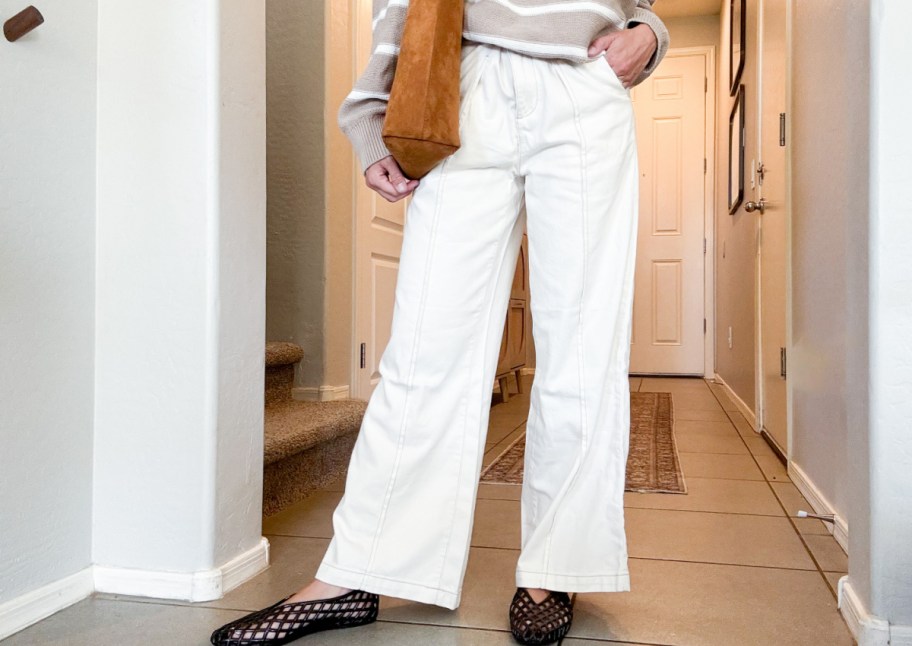 woman in white jeans