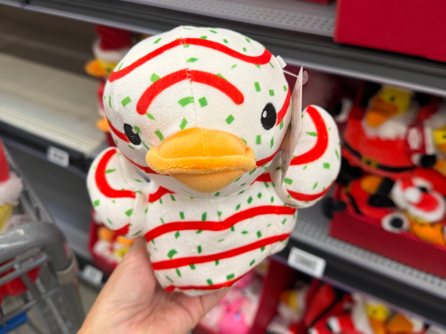 hand holding plush christmas duck