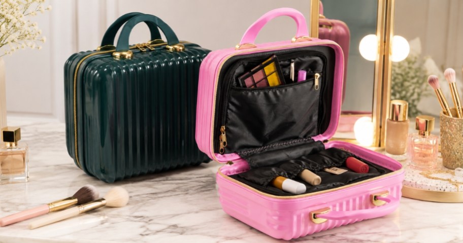 two hard shell beauty cases, one open