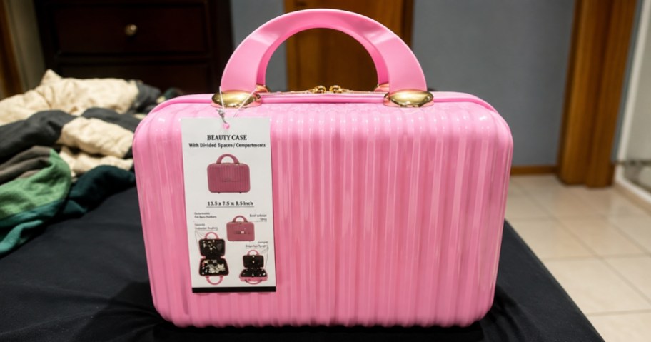 a pink hard shell beauty case