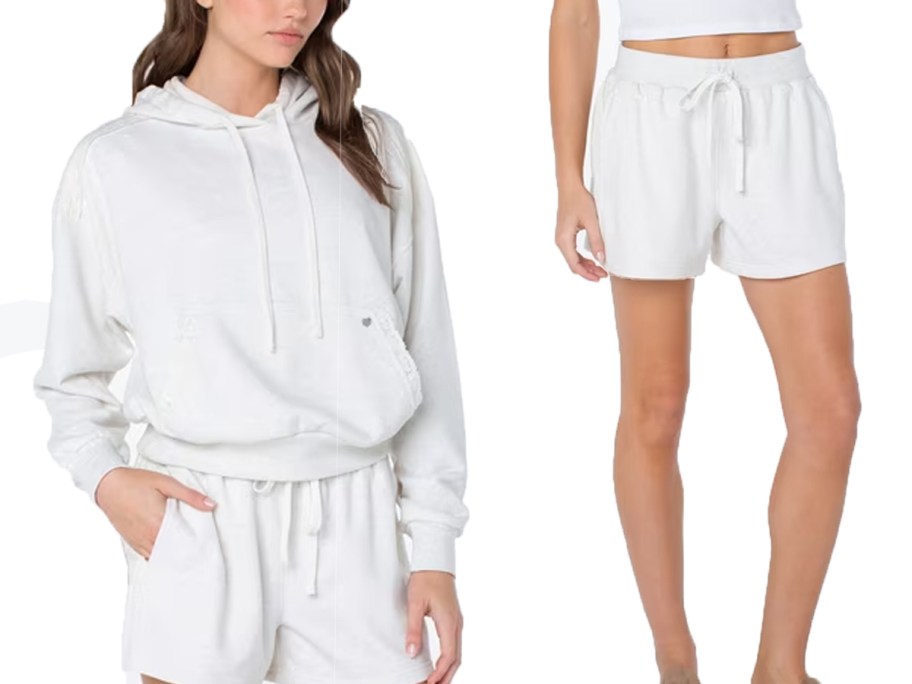 woman wearing white sweatshirt and shorts 