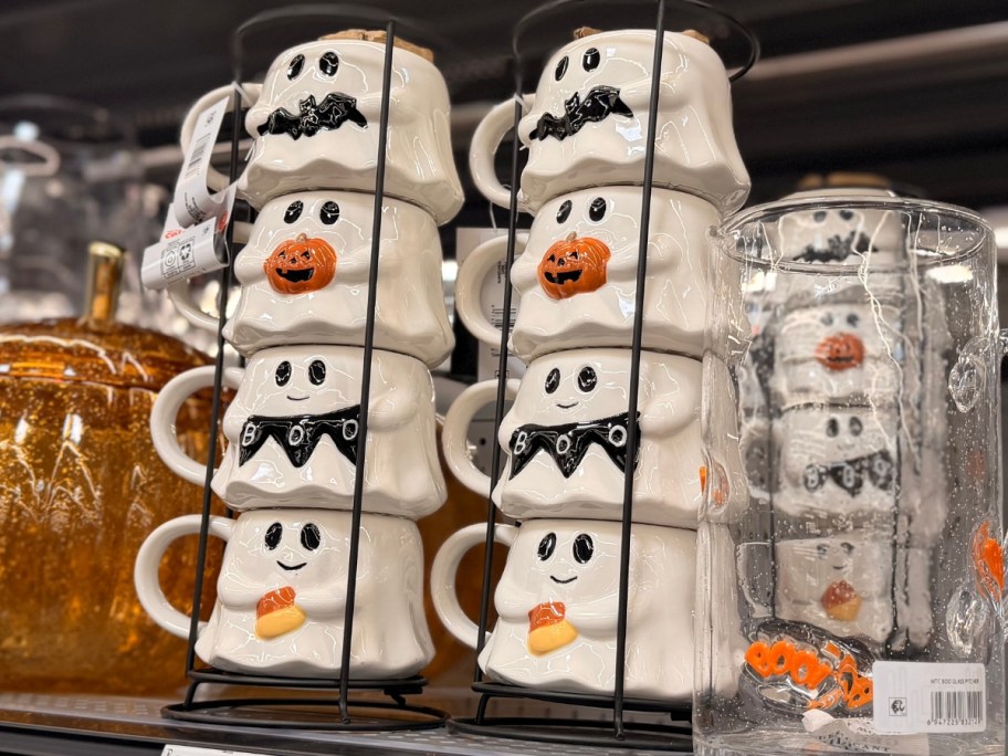 ghost shaped stacking Halloween mugs in holders on a store shelf