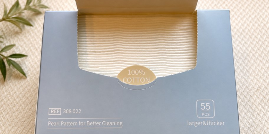 blue box with towels inside on table