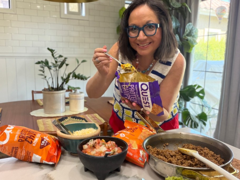 woman eating walking tacos with quest chips (1)