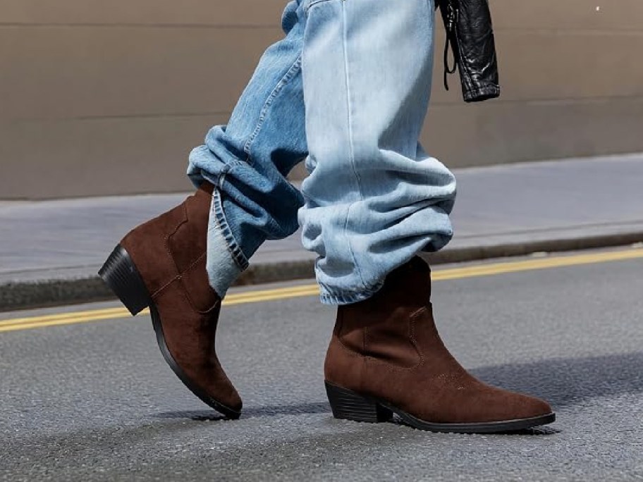 woman wearing brown ankle booties