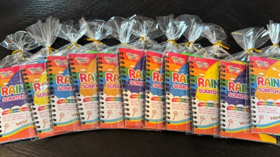 a multipack of scratch art books fanned out on a tabletop
