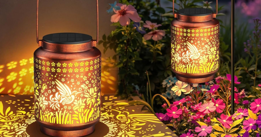 2 solar lanterns lit up outside