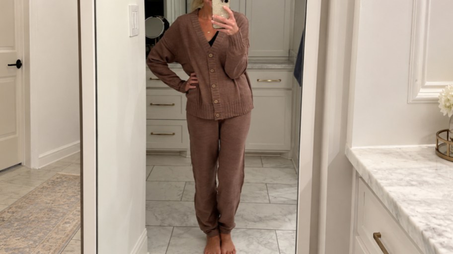 a woman in a 2 piece cardigan set taking a selfie