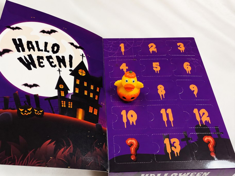 pumpkin rubber duck on top of a halloween advent calendar box