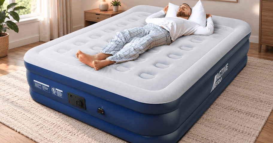Active Era raised king air mattress with built-in pump shown in a realistic bedroom setting with a man resting on top.