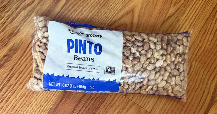 bag of Amazon Grocery Dried Pinto Beans on a wood table