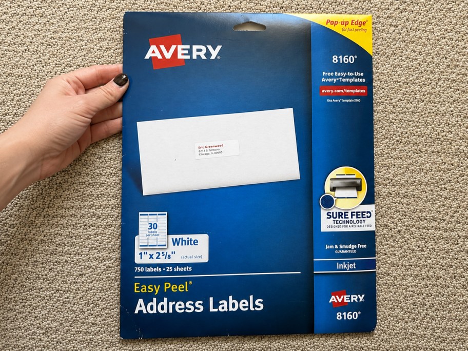 hand holding up a pack of Avery Easy Peel Address Labels
