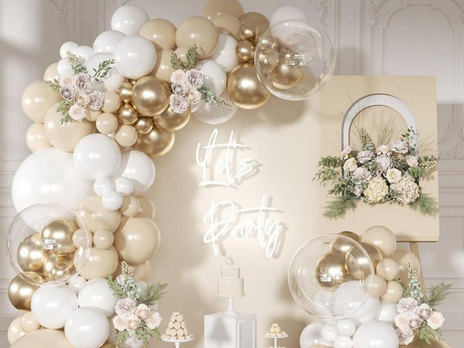Ballon garland kit displayed with signs around
